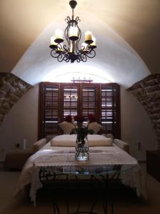 Rúm í herbergi á Lighthouse Suite - Acre