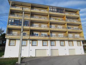 an apartment building with balconies on the side of it at Hotel Restaurante La Parra in La Franca