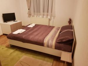 Postel nebo postele na pokoji v ubytování BigCitty Rooms