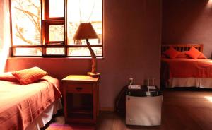 Ένα ή περισσότερα κρεβάτια σε δωμάτιο στο Hotel Kimal