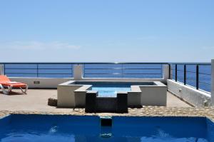 a swimming pool on the roof of a house at Villa GUACIMARA in Igueste