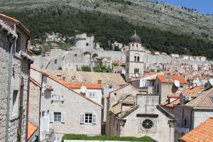 a view of a town with a mountain in the background at Apartment Jacqueline in Dubrovnik