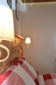 A bed or beds in a room at Privat Gazda Pension