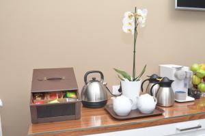 a counter with a tea kettle and a box on it at B&B La Movida in Naples