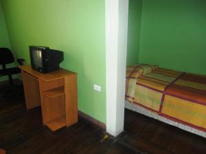 TV a/nebo společenská místnost v ubytování Hotel Garden + 37 fotografií