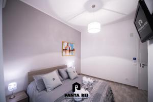 En eller flere senge i et værelse på Pantarei B&B