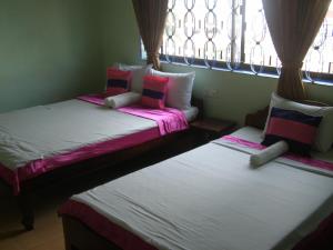 Postel nebo postele na pokoji v ubytování Bun Kao Guesthouse