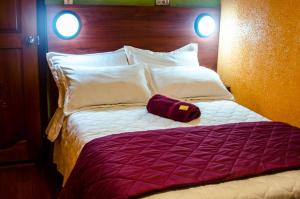 Ένα ή περισσότερα κρεβάτια σε δωμάτιο στο La Estación Hostal