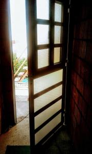 a door leading into a room with a window at Residencial Marluc in Río Cuarto