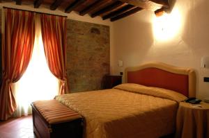 Posteľ alebo postele v izbe v ubytovaní Palazzo Loup Hotel