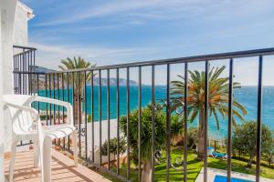 
a beach scene with a view of the ocean at Tuhillo Parador Nerja in Nerja
