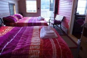 מיטה או מיטות בחדר ב-Mountain Thyme Getaway