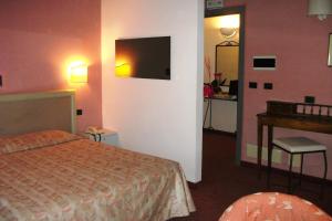Posteľ alebo postele v izbe v ubytovaní Palazzo Loup Hotel