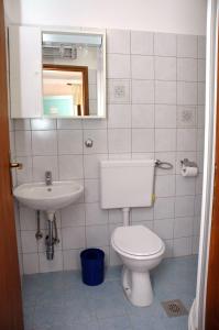 Ванна кімната в Apartments Lazzarini Battiala