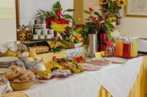 a table with a buffet of food on it at Hotel Sylesia in Letojanni