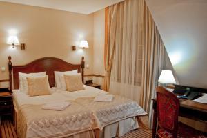 Posteľ alebo postele v izbe v ubytovaní Hotel St. Bruno