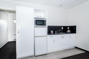 Köök või kööginurk majutusasutuses White Heron Motor Lodge