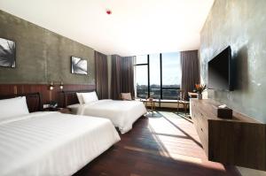 Postel nebo postele na pokoji v ubytování SIM Boutique Hotel