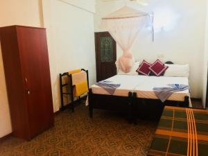 Ένα ή περισσότερα κρεβάτια σε δωμάτιο στο Casalanka Hotel