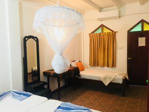 Ένα ή περισσότερα κρεβάτια σε δωμάτιο στο Casalanka Hotel