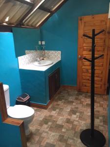 a bathroom with a white toilet and a sink at Dugong Koh Sukorn in Ko Sukon +35 photos