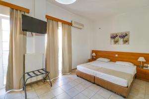 Posteľ alebo postele v izbe v ubytovaní Marirena Hotel