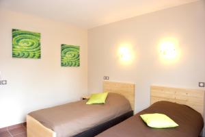 Ein Bett oder Betten in einem Zimmer der Unterkunft Les Hauts du Gevaudan
