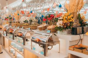 a store with a bunch of flowers and baskets at Terra boutique hotel in Da Nang