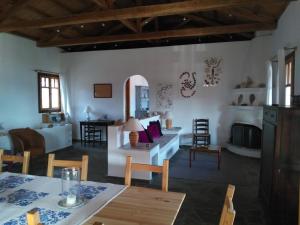 a living room with a couch and a table at Chelidonia in Steni Vala Alonissos