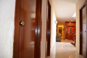 an open door with a hallway in a house at Hotel Sant Jordi in Tarragona