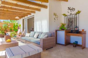 a living room with a couch and a table at Son Vanrell in Montuiri
