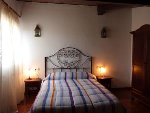Кровать или кровати в номере Hostal Restaurante Las Canteras
