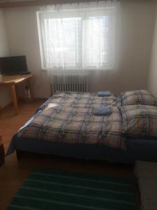 Un pat sau paturi într-o cameră la Objekt Nizna