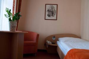 Postel nebo postele na pokoji v ubytování Hotel Paradies