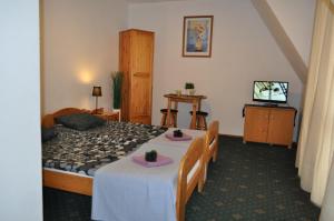 Ένα ή περισσότερα κρεβάτια σε δωμάτιο στο Willa Otulina pod Giewontem