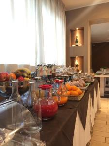 a buffet with fruits and vegetables on a table at Hotel 325 Tor Vergata in Tor Vergata