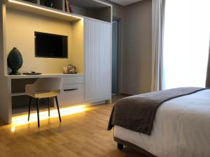 A television and/or entertainment centre at 200 ROOMS & TERRACE