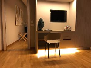 A television and/or entertainment centre at 200 ROOMS & TERRACE