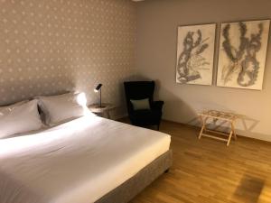 A bed or beds in a room at 200 ROOMS & TERRACE