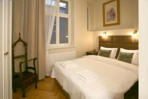 En eller flere senge i et værelse på MJZ Apartments Old Town Krakow