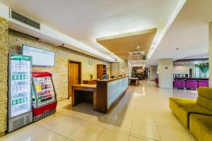 a restaurant with a soda machine in a lobby at DeSilva Warszawa Piaseczno in Piaseczno