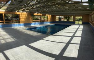 a large swimming pool in a large building at Silver Ridge Retreat in Sheffield