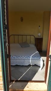 Säng eller sängar i ett rum på Villetta del Conero