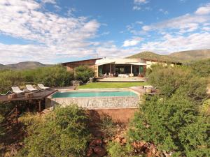 an aerial view of a house with a swimming pool at Omurenga in Omaruru