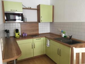 Kuchyň nebo kuchyňský kout v ubytování Hotel Alt Annaberg
