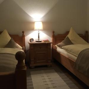 Postel nebo postele na pokoji v ubytování Hotel Alt Annaberg