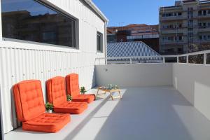 A balcony or terrace at Bonjardim Flats - T1 + 1 com terraço