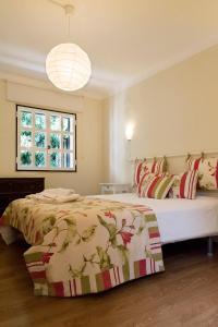 Postel nebo postele na pokoji v ubytování Casa do Castelo
