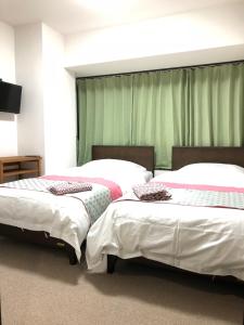 Postel nebo postele na pokoji v ubytování GreenHotel