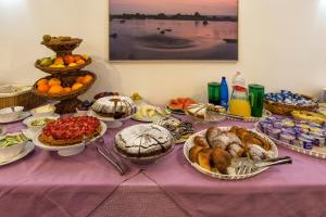 a table topped with lots of different types of food at Hotel O'scià in Lampedusa